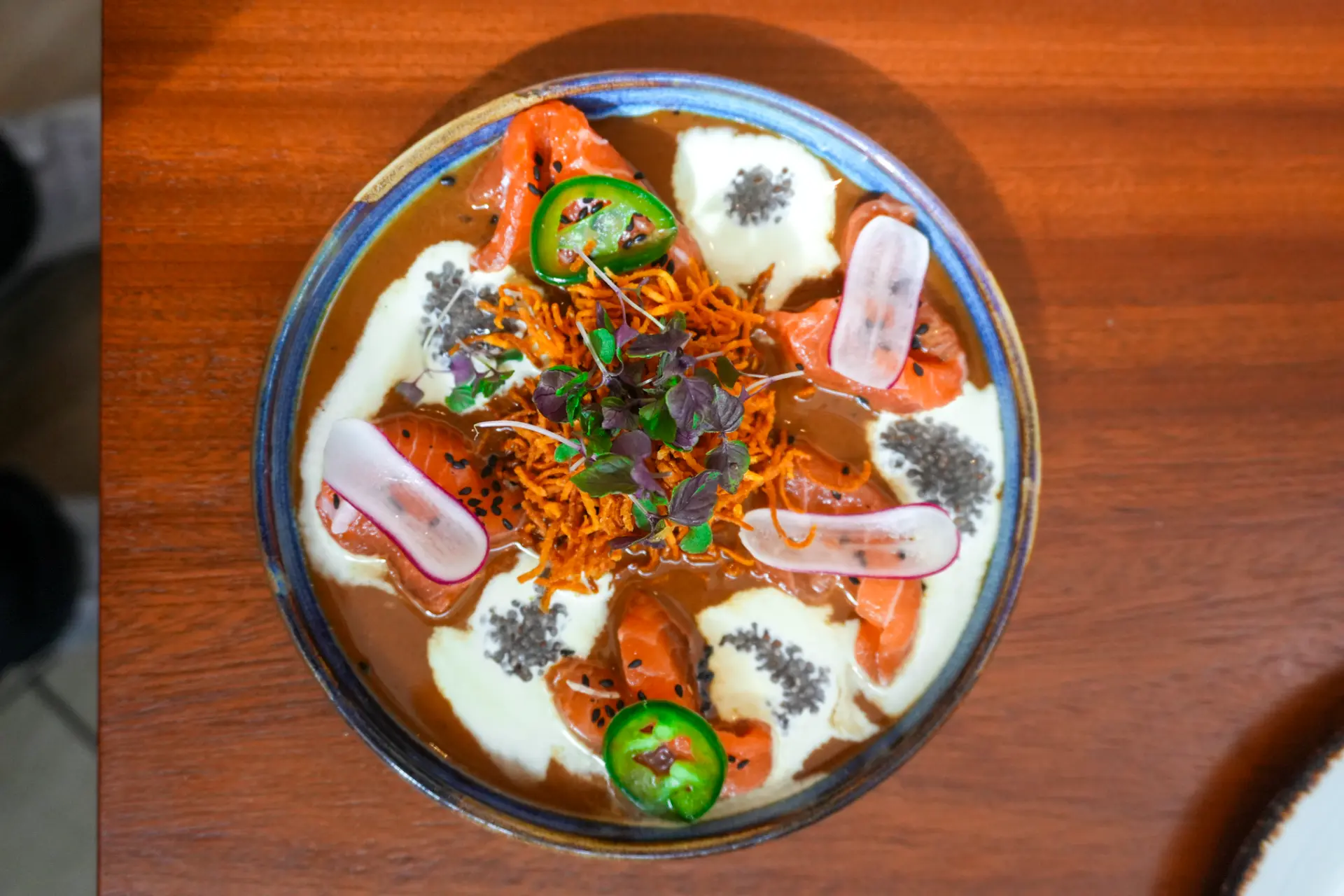 Peruvian dish photographed from above in a hand-glazed bowl